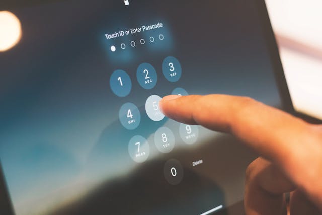 Close-up-of-a-finger-entering-a-passcode