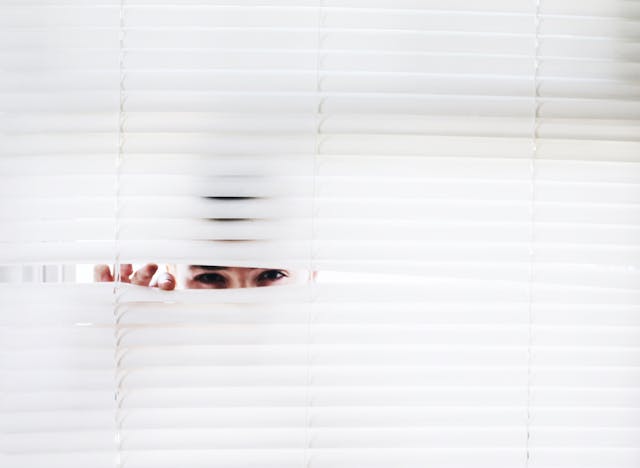 Photography of Person Peeking.jpg